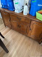 Front view of the French Provincial buffet cabinet showing drawer and doors