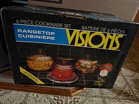 Box of Visions 6-piece cookware set model V-300 showing product images and branding