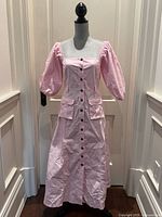 Full front view of the pink midi dress on mannequin