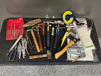 All tools laid out on black surface