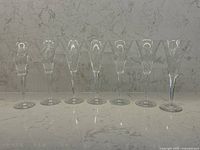 Seven Waterford crystal flutes lined up side by side