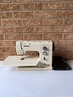 Full view of Bernina 831 sewing machine with extension table and foot pedal