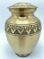 Full view of urn showing finish and engraved band