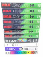 Front view of stacked RCA, Fuji, Sony, Citizen VHS tapes