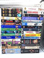 Full front view of all VHS tapes stacked showing spine titles