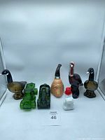 Group shot of all seven Avon figural bottles