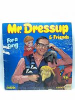 Front cover of LP showing title, artist image, visible heavy wear and creasing