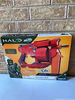 Front of sealed box showing Nerf Halo Infinite Mangler blaster image and features