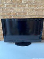 Front view of Panasonic 32" LCD TV on stand