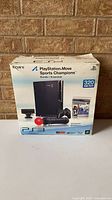 Retail PS3 Move Sports Champions 320 GB bundle box front