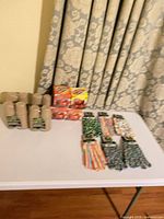 Lot overview showing seed pots, seed kits and all six glove pairs on table