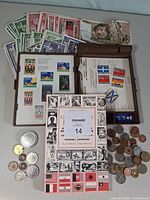 Full lot showing stamps in cases, Canadian Tire coupons, book, and mixed coins
