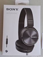 Front of sealed retail box showing headphone image and model number