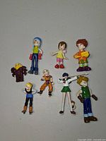 All nine figures laid out on table