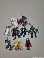 All ten Digimon mini figures spread on table
