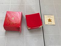 Outer red box, presentation case, COA card