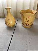 Bud vase and planter side by side showing overall style and matching design