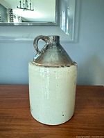 Full front view of jug showing form and glaze contrast