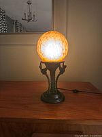 Lamp lit on wooden surface showing full form