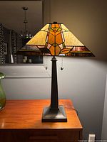 Full lamp illuminated on furniture showing overall form