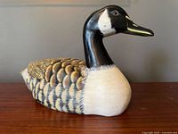 Left side view of carved wood goose decoy