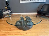 Side view of bear base and oval glass top