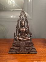 Front view of bronze Phra Phuttha Chinnarat Buddha statue