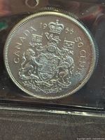 Reverse of 1966 Canada 50-cent coin showing coat of arms