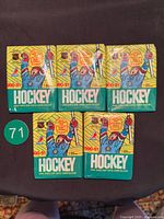 Front view of five sealed 1990-91 O-Pee-Chee NHL Hockey packs