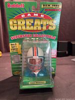 Front view of packaged Dan Marino Game Greats collectible helmet bust