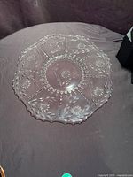 Full view of round Corn Flower glass tray on surface