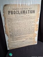 Full poster wrapped in plastic showing overall condition and size