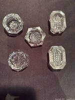Top view showing five assorted crystal salt cellars