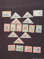 All 19 stamps laid out on dark background