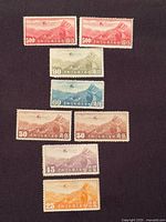 All eight airmail stamps arranged together showing denominations and colours