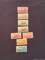 Full view of the seven different overprinted airmail stamps