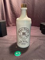 Full view of white Hudson's Bay stoneware whisky jug with cork