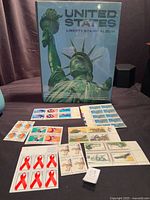 Front cover of album with Statue of Liberty and stamp panes/blocks arranged in front