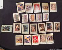 Overview of all stamps laid out on dark surface