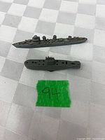 Top view of both plastic naval toys on table showing size and shape