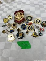 Overview of all pins laid out on table