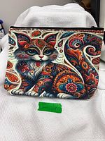 front view of multicolour cat makeup bag