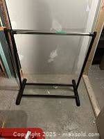 Full view of black metal clothing rack