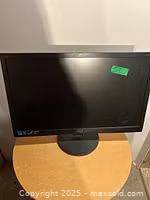 Front view of AOC monitor on round base