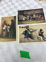 Three postcards laid out on table