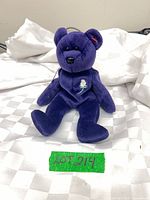 Full view of purple Princess Diana Beanie Baby bear seated