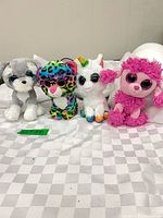 Group shot of four Ty Beanie Boos plush toys