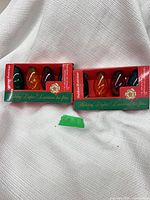 Two boxed Holiday Lights sets showing front packaging and bulbs