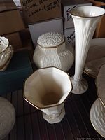 All three Lenox pieces grouped: ginger jar with lid, tall bud vase, hexagonal vase