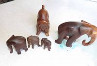 Group shot of all five wooden animal figures